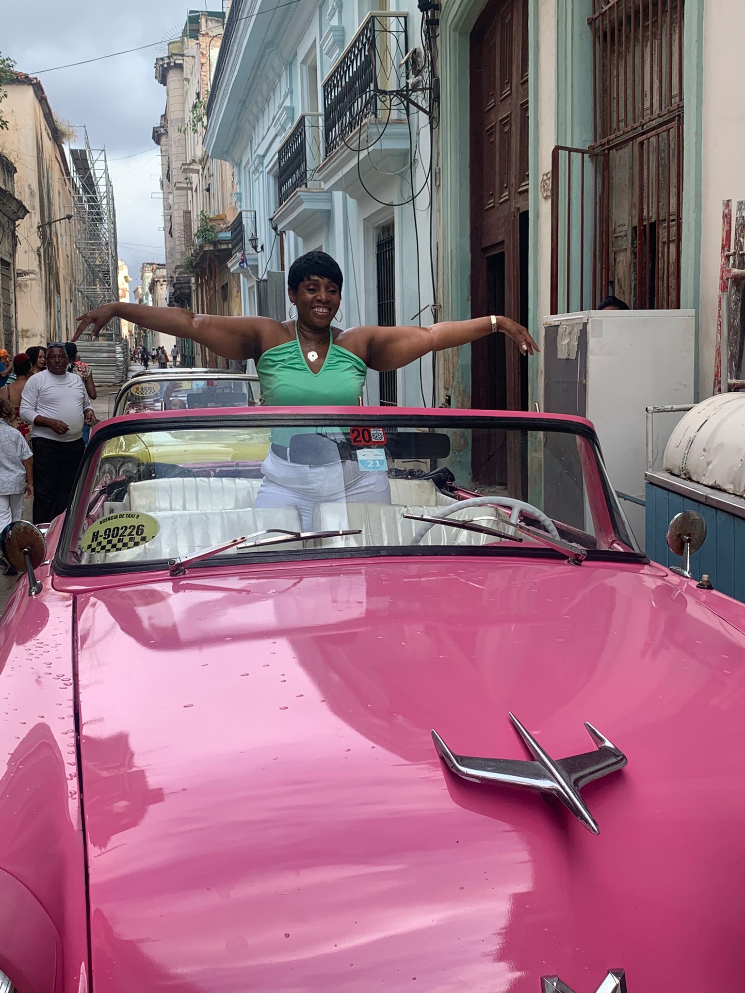 Annie poses as she gets ready for Havana classic car tour