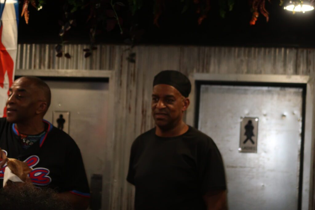 Del the owner of Ochi Restaurant watches on