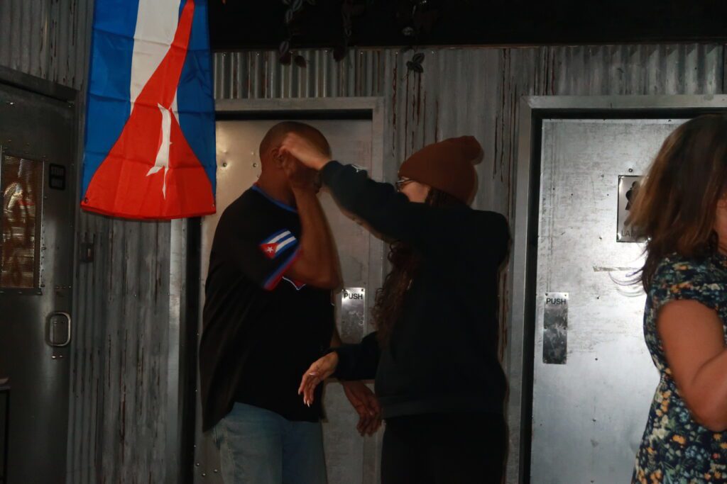 Jase and Roy dancing at A Taste of Salsa Caribbean Roast event