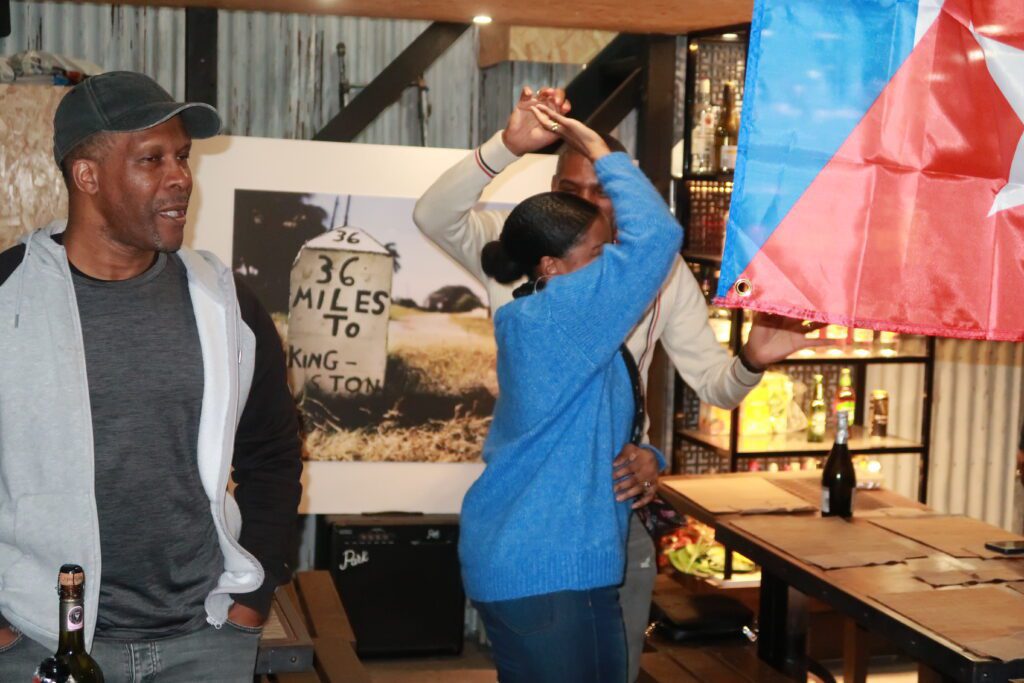 Leana and Pat dancing with Steevo againat A Taste of Salsa Caribbean Roast event