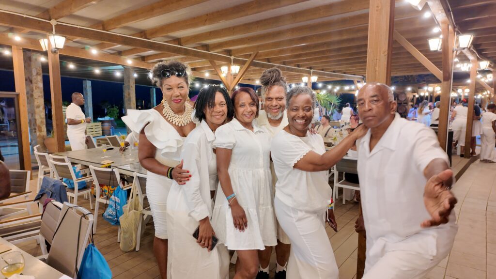Travellers & Team Pose at White Party