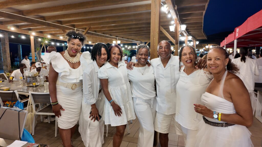 Travellers & Team Pose at White Party