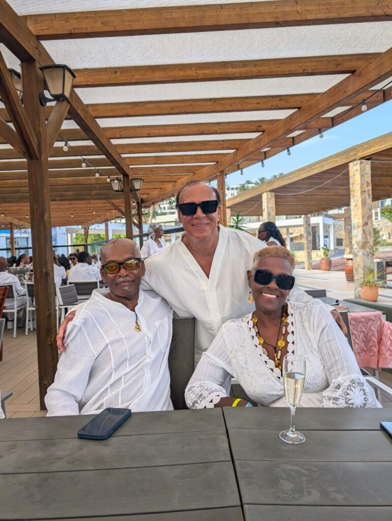 'A Taste of Salsa' Travellers Pauline, Baz and Alan pose at SALSOGA '25 White Party