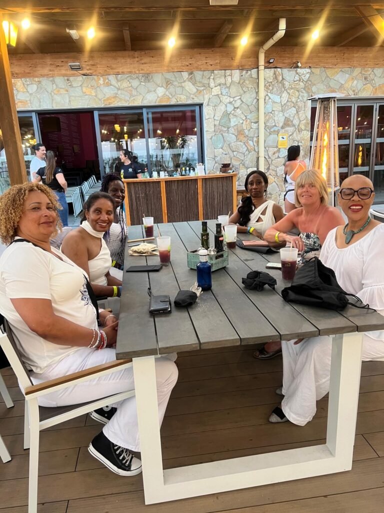 SALSOGA guests relax at SALSOGA '24 White Party