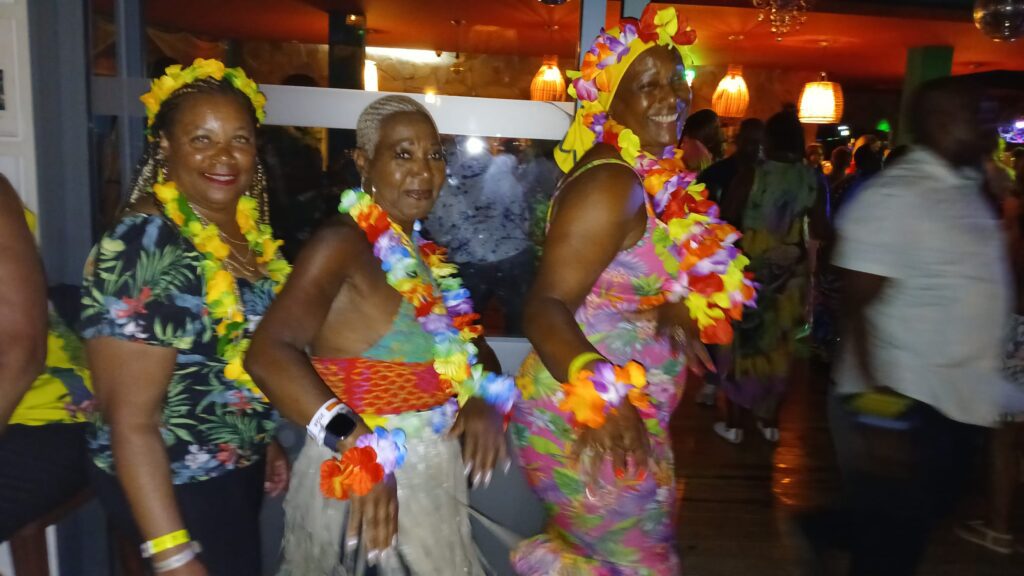 Lola, Rose and Ereka pose at SALSOGA '24 Hawaii night