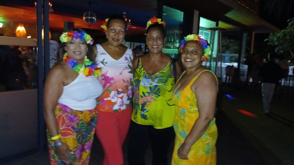 Carol, Rhoda, Denise and Monique pose at SALSOGA '24 Hawaii night