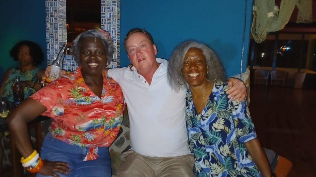 Sandra, Owen and Rubylyn pose at SALSOGA '24 Hawaii night