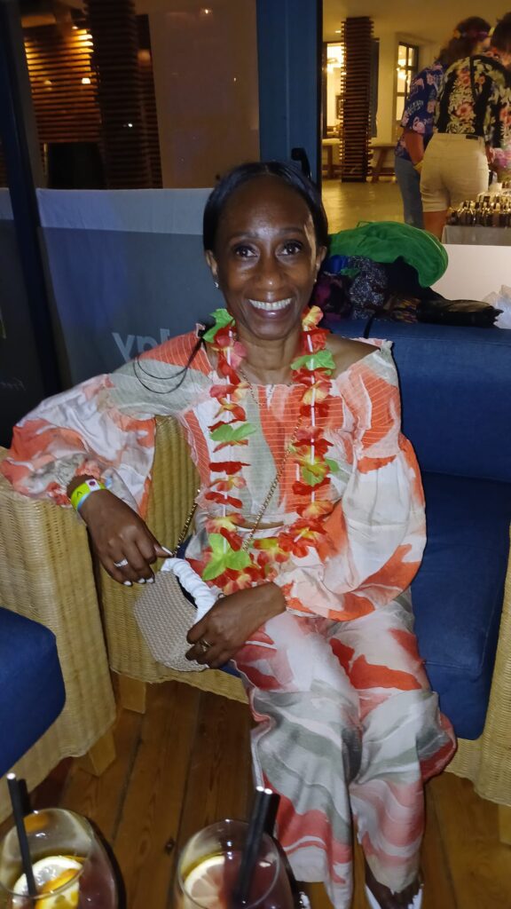 Traveller poses at SALSOGA '24 Hawaii night