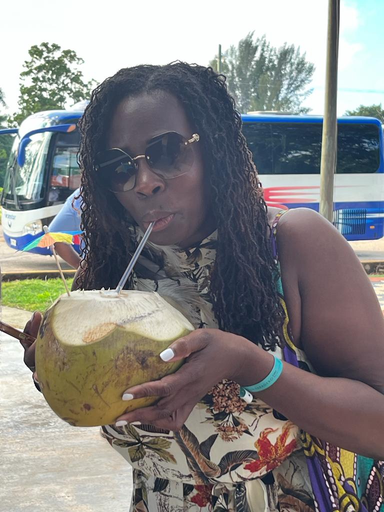 Oneka poses with coconut during transfer to Varadero from Havana