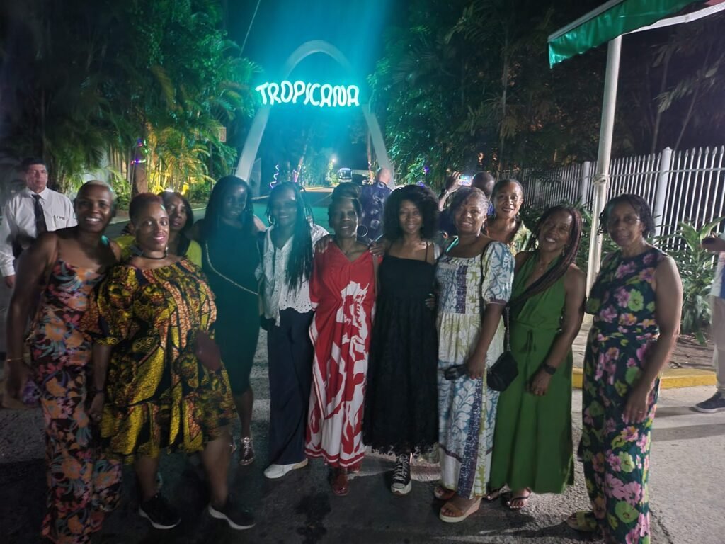 Travellers pose for a group shot at Tropicana cabaret in Havana