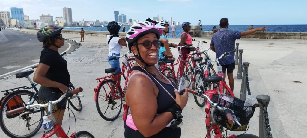 Travellers stop to see coastline during Havana Bike tour