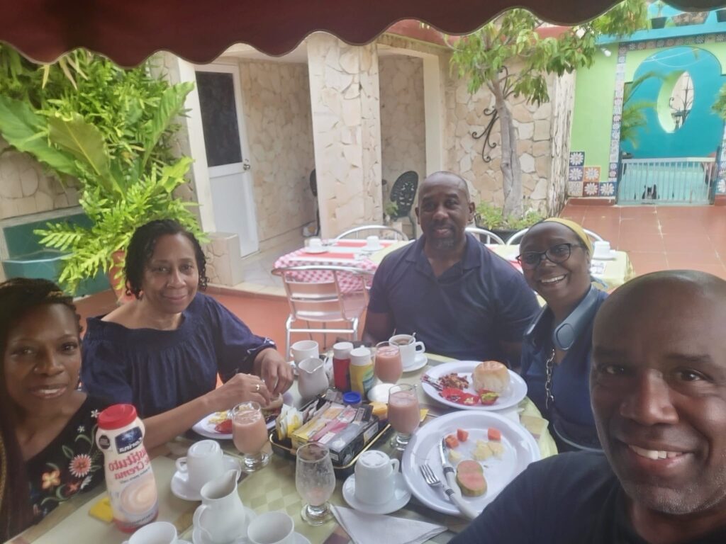 Travellers take a moment at breakfast in casa Chez Nous Havana