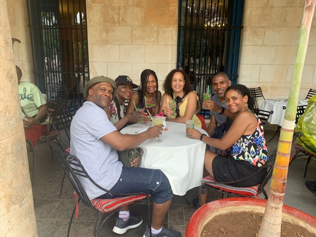 Travellers pose at Lunch in Havana