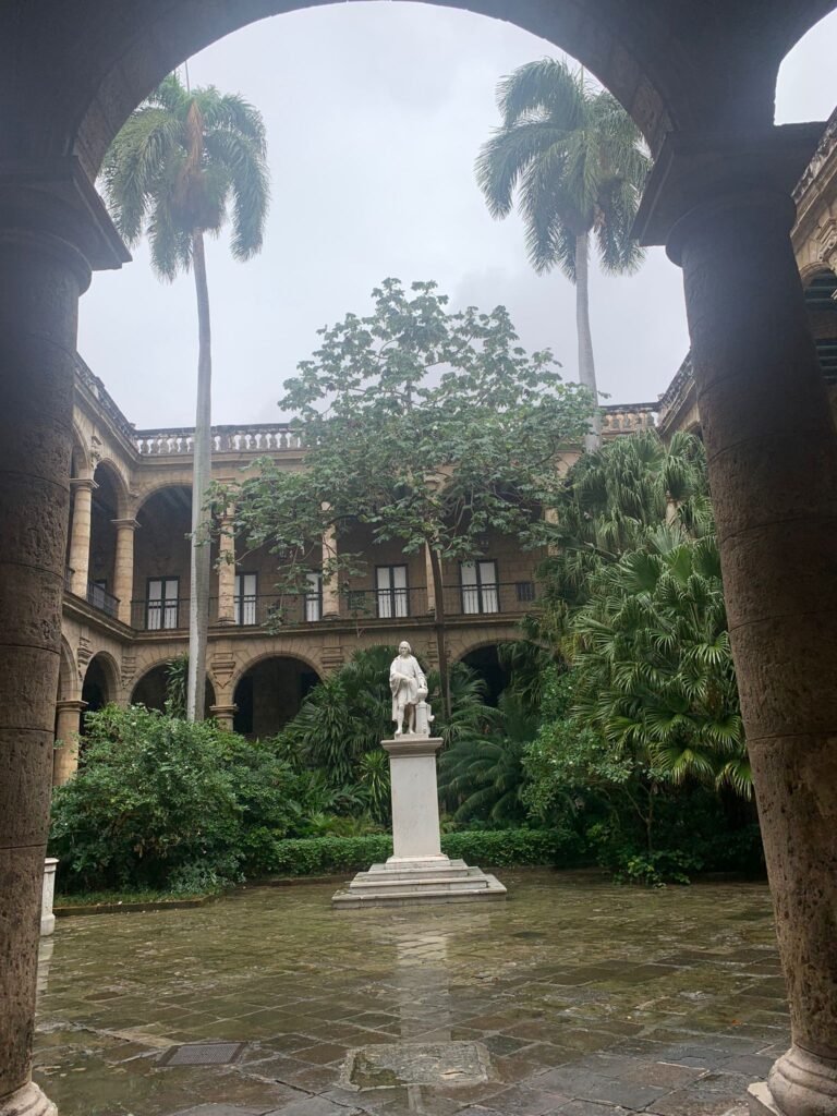 Statue in middle of building in Havana