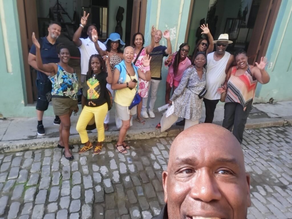 Take two travellers pose at Casa de Africa in Havana