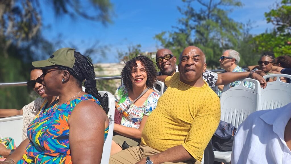 Travellers pose on the Havana bus tour