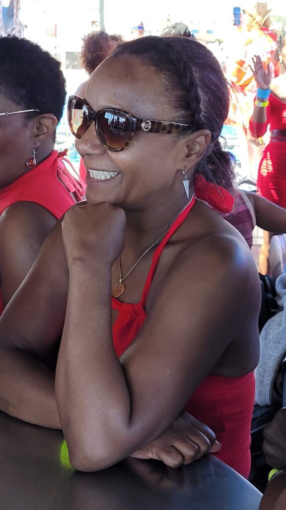 Anita smiling at the bar during SALSOGA '24 Boat Party